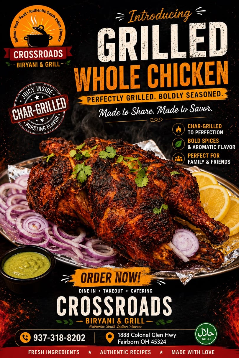 Crossroads Biryani & Grill's char-grilled whole chicken, garnished with cilantro, red onions, and lemon slices.